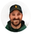 Circular profile portrait of Alex Johnson wearing a dark cap and a dark green top.