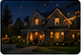 Nighttime illuminated-house thumbnail for Martinez Family.