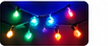 Close-up of saturated blue, green, red, and warm white holiday bulbs.