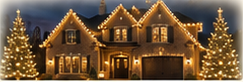 Twilight exterior photograph of a larger home with warm white lighting, trees, and lit roofline.